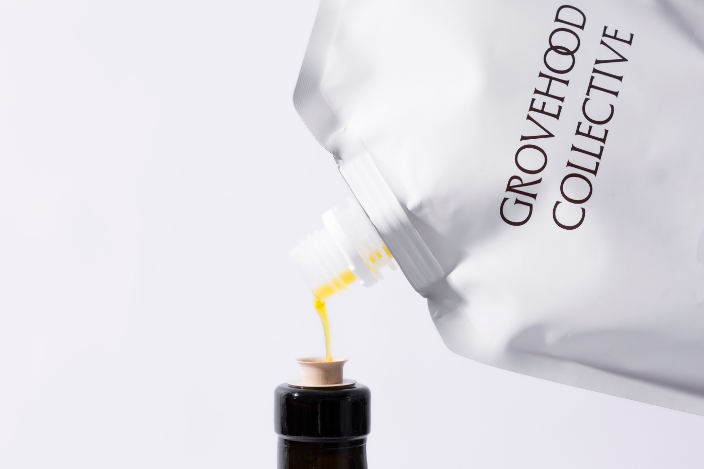 Grovehood Collective bottle being refilled