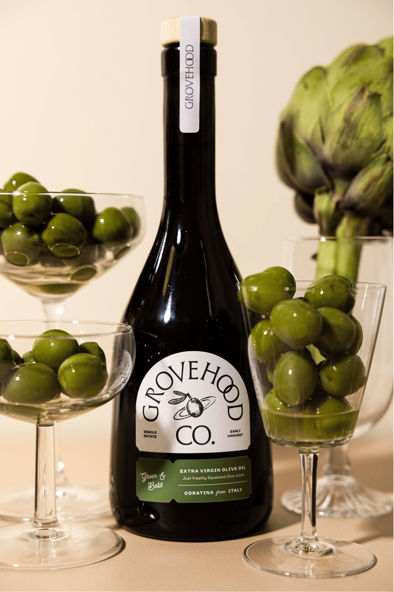 Grovehood Collective Italian extra virgin olive oil bottle with green olives