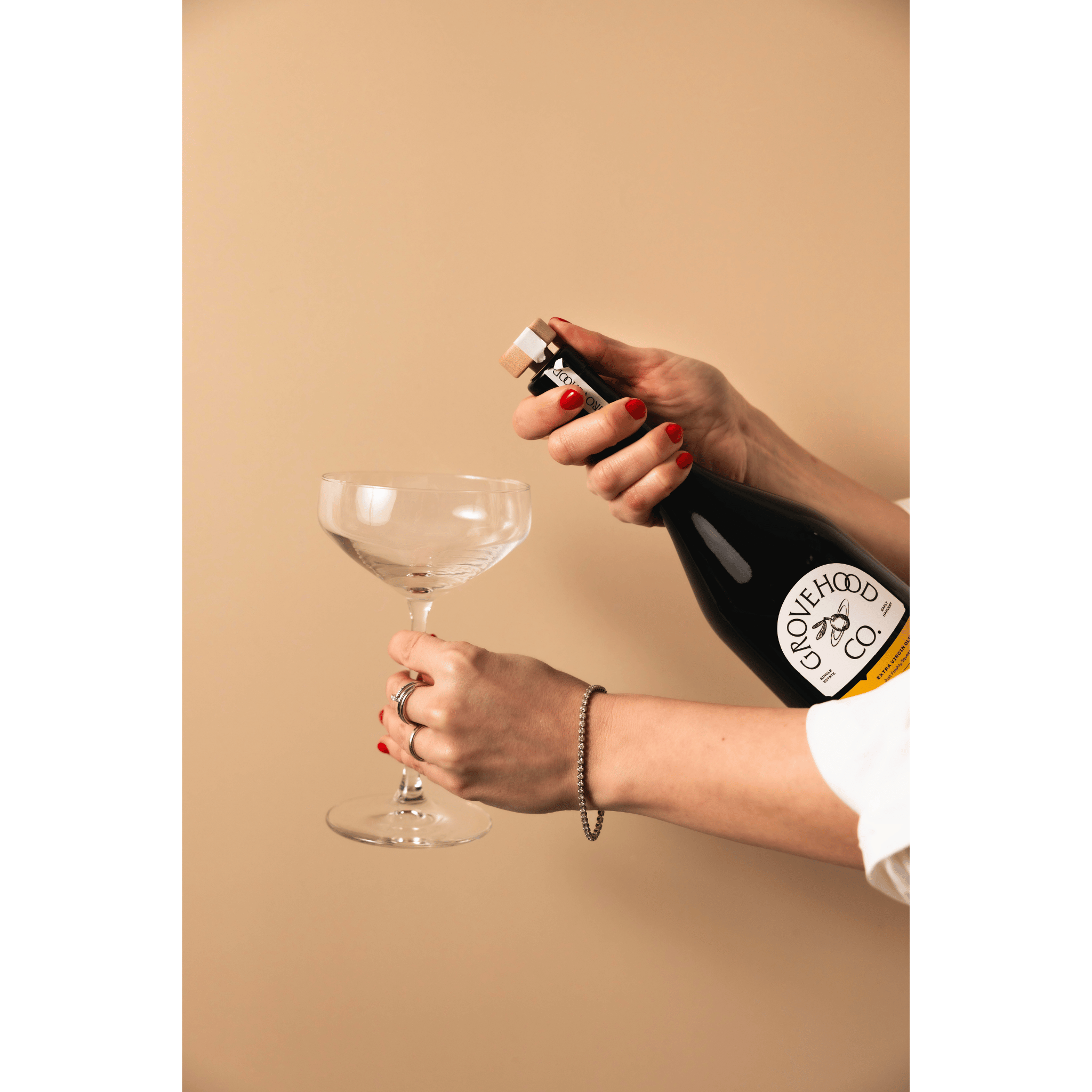 Grovehood Collective Spanish extra virgin olive oil bottle popped like champagne